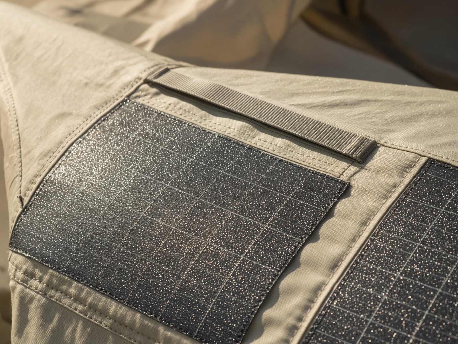 Flexible solar cells seamed into the pale sand rainfly